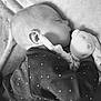 baby, sleeping, plush_toy, blanket, onesie, infant, peaceful, cozy, soft, cute, child, face, head, hand, monochrome, portrait, resting, tender, cuddling, young