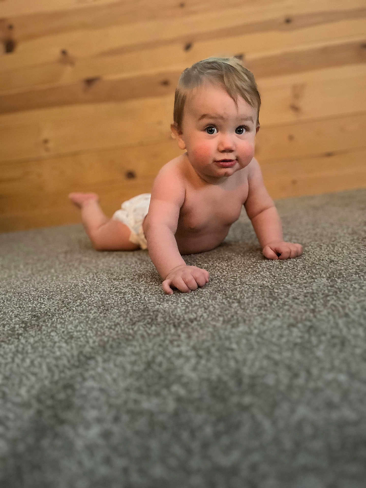 Maddox joined the competition — help win amazing prizes! baby, child, crawling, diaper, carpet, wooden_wall, indoor, curious, cute, chubby_cheeks, skin, floor, infant, young_child, expression, person, portrait, natural_light, home, playful