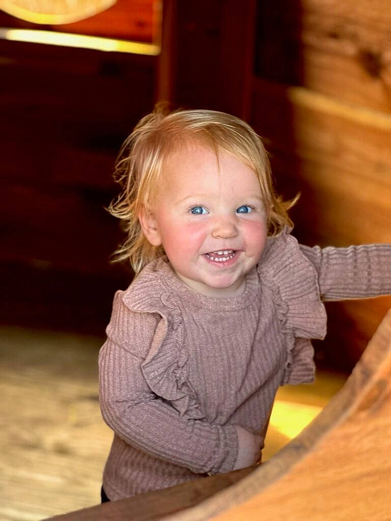 Lanna joined the competition — help win amazing prizes! baby, baby_toddler_clothing, blond, chair, cheek, child, chin, floor, flooring, fun, hair, happy, hardwood, human_body, iris, joy, leisure, person, skin, smile