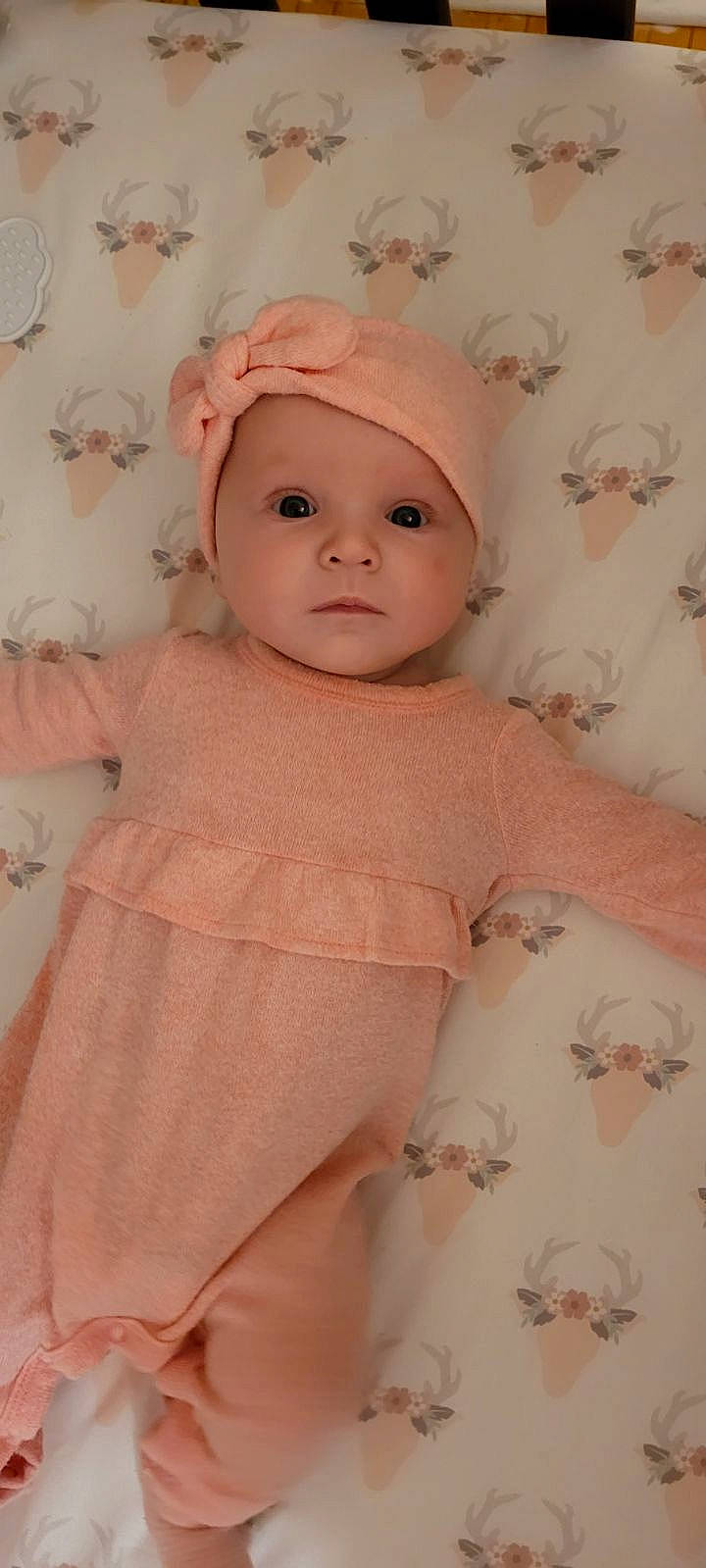 Lanna joined the competition — help win amazing prizes! baby, baby_toddler_clothing, beige, cap, cheek, child, dress, eye, eyelash, headgear, headwear, linens, lip, magenta, pattern, peach, person, pink, room, skin