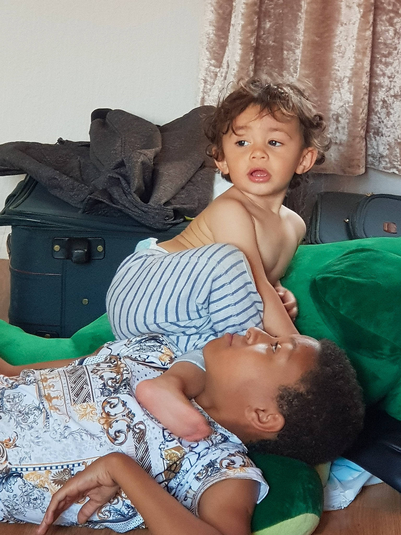 Lucian is registered to the contest to win money with this photo: black_hair, child, daughter, finger, leg, mother, person, sitting