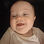 Willow joined the competition — help win amazing prizes! baby, smiling, face, infant, child, white_shirt, pink_logo, closeup, happy, cute, portrait, young_child, chubby_cheeks, lying_down, food_stain, skin, head, eyes, mouth, person