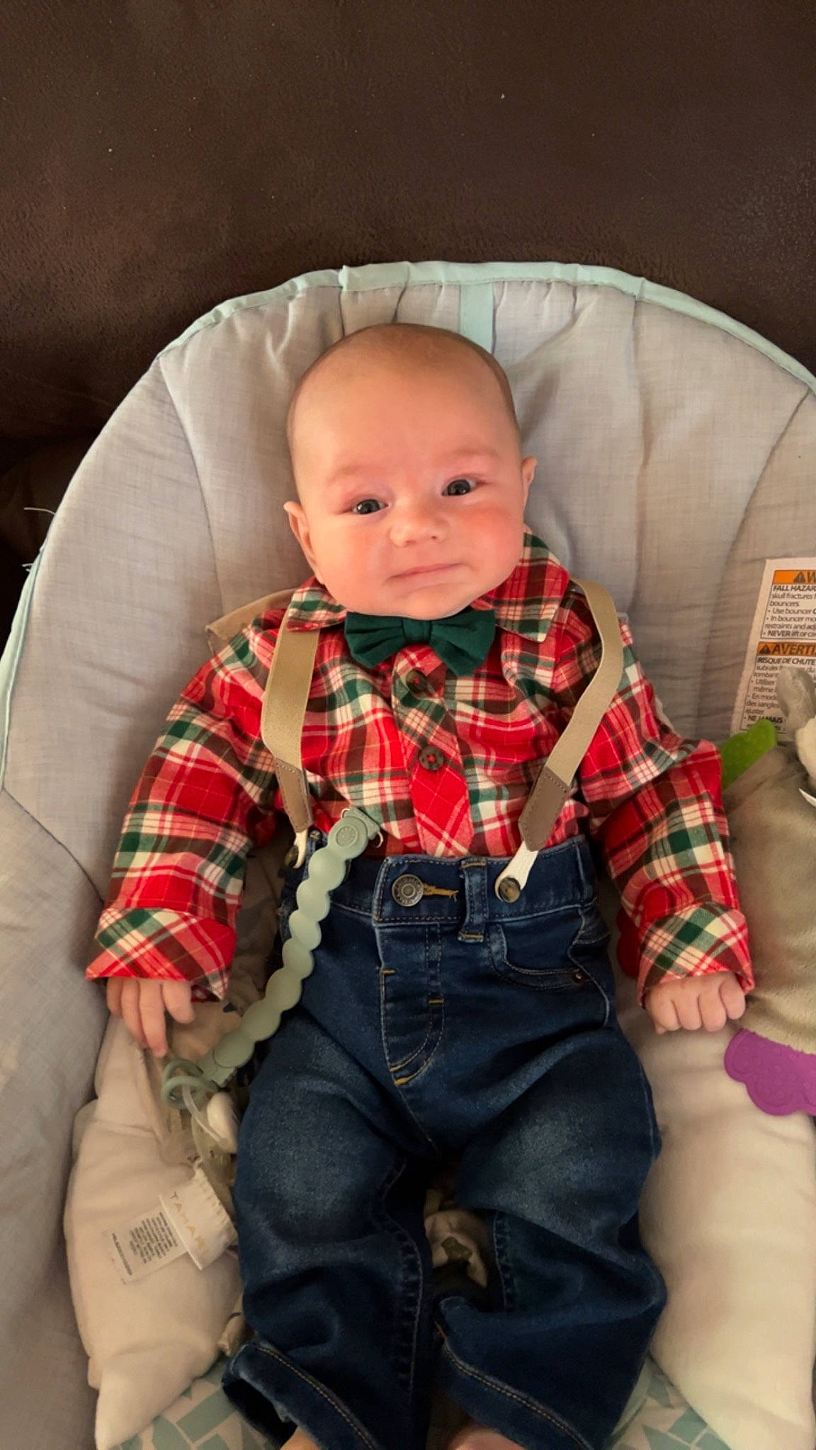 Carter is registered to the contest to win money with this photo: baby, baby_toddler_clothing, bow_tie, collar, comfort, doll, dress_shirt, eye, hair, hand, head, human_body, lap, pattern, person, plaid, sleeve, tartan, textile, toddler