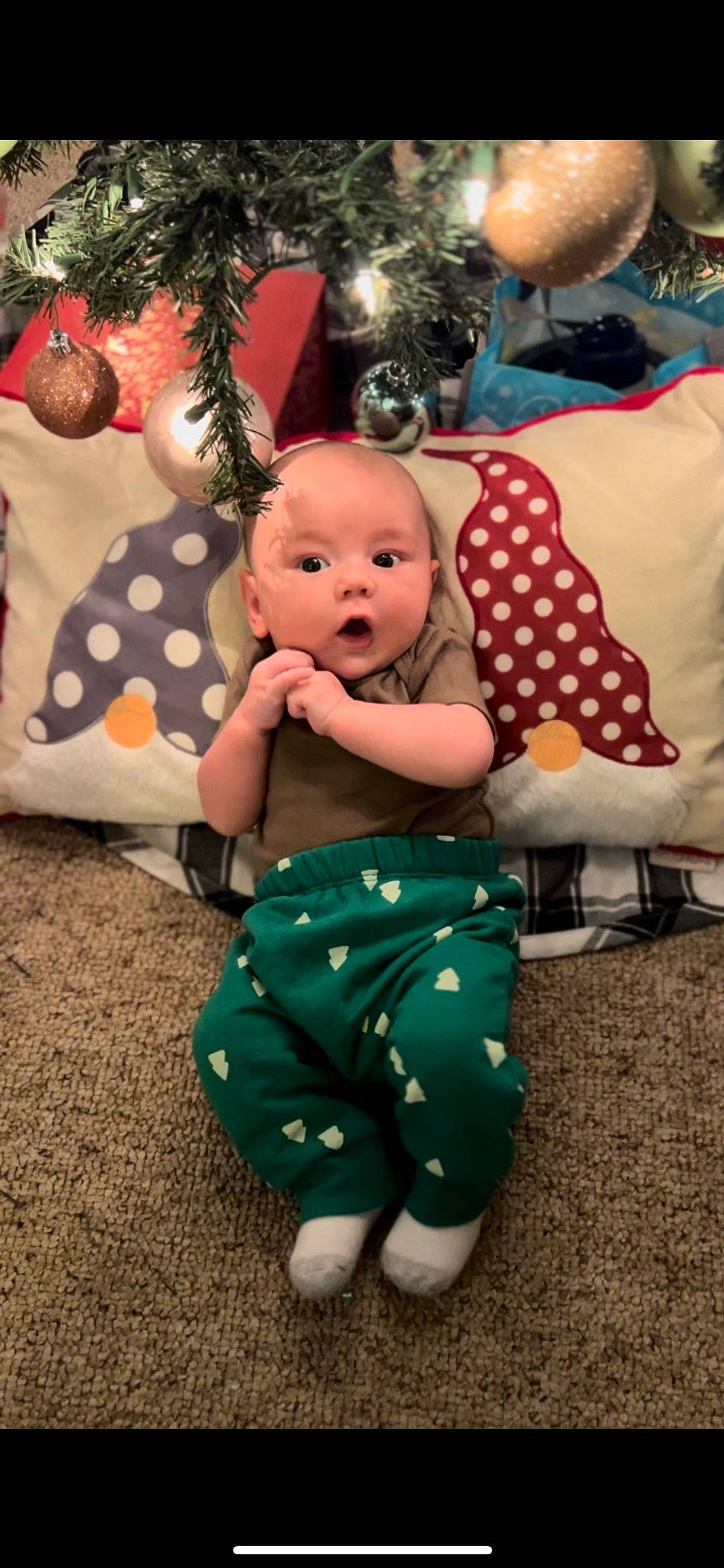 Carter is registered to the contest to win money with this photo: baby, baby_products, baby_toddler_clothing, child, comfort, event, foot, fruit, fun, grass, happy, holiday, pattern, person, plant, sitting, stuffed_toy, surprise, textile, toddler