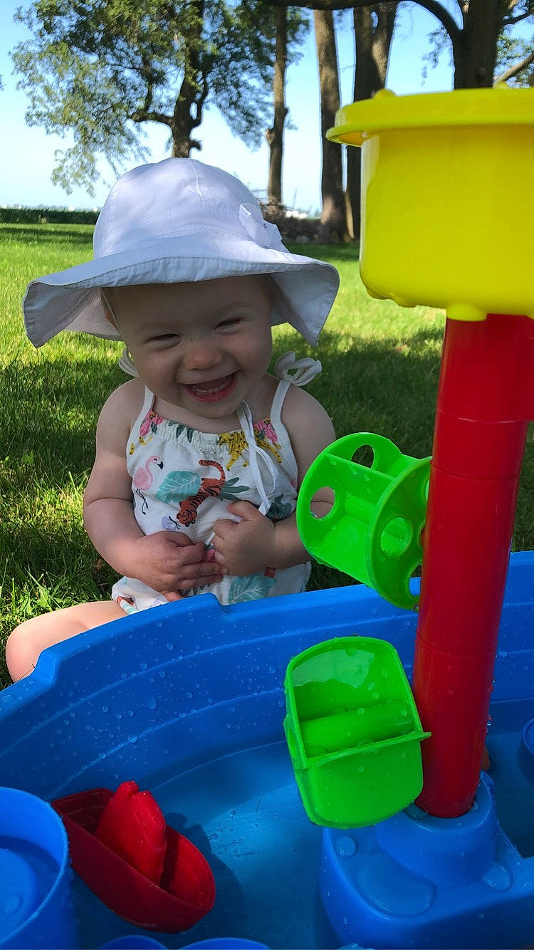 Helena joined the competition — help win amazing prizes! baby_toddler_clothing, blue, fun, grass, green, happy, hat, headwear, leisure, person, photograph, pink, playground, product, recreation, sky, smile, summer, sun_hat, toddler