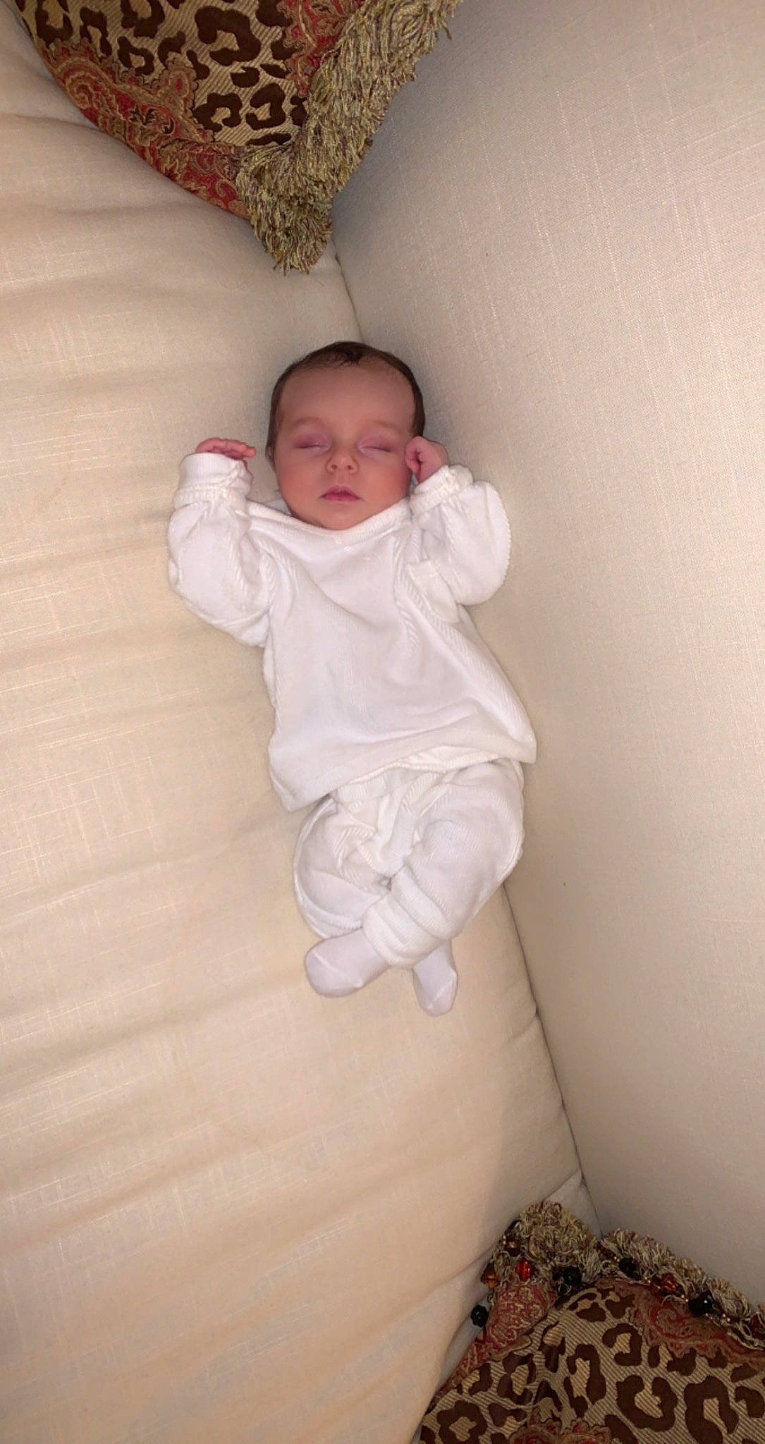 Ensleigh Rae is registered to the contest to win money with this photo: baby, baby_toddler_clothing, cheek, child, comfort, eye, flash_photography, flooring, foot, hardwood, linens, person, room, sitting, skin, sleeve, textile, toddler, wood