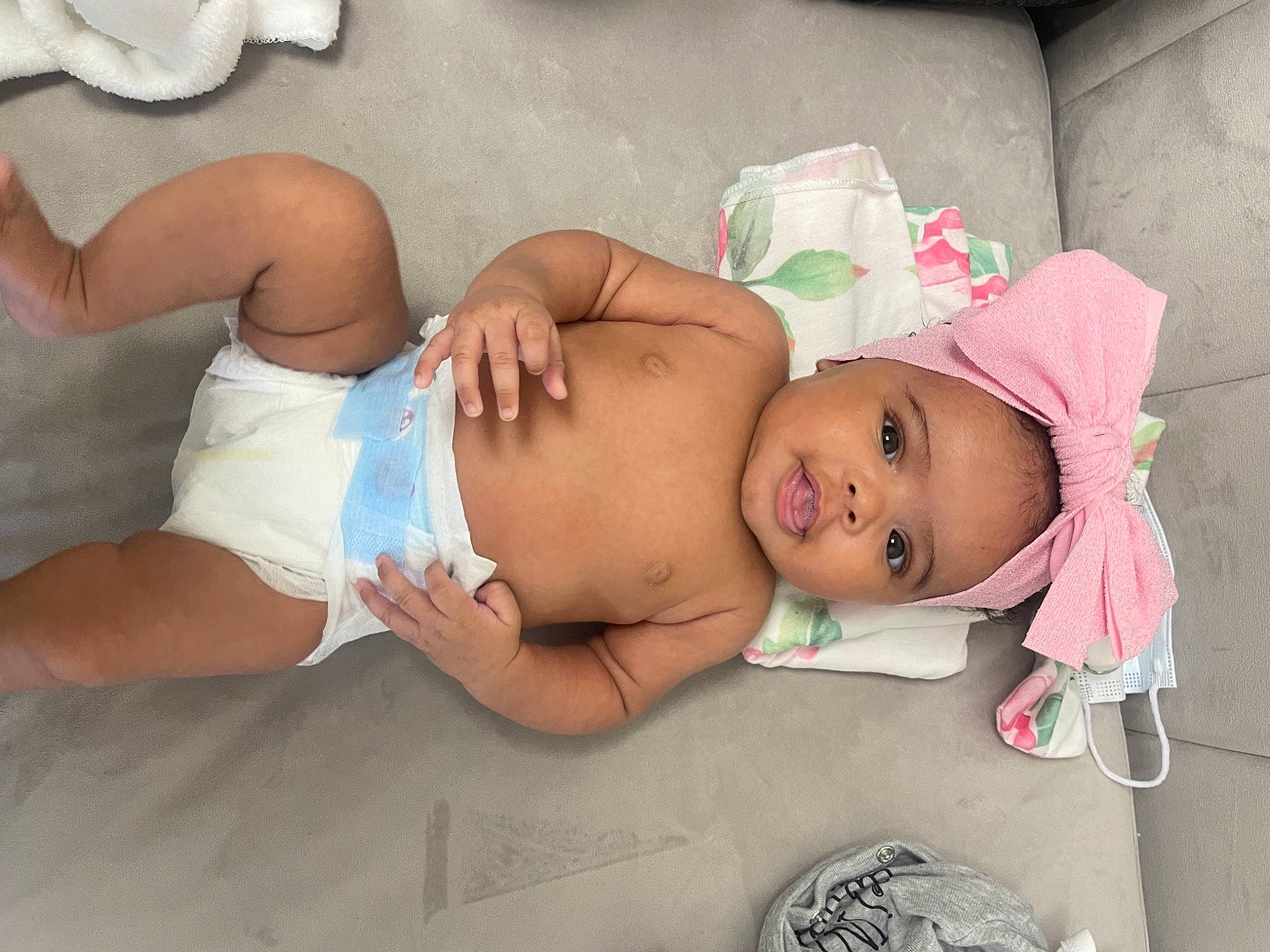 Santana joined the competition — help win amazing prizes! abdomen, baby, baby_products, baby_toddler_clothing, bed, bedtime, chest, child, comfort, diaper, elbow, headwear, human_leg, knee, linens, person, room, skin, stomach, thigh