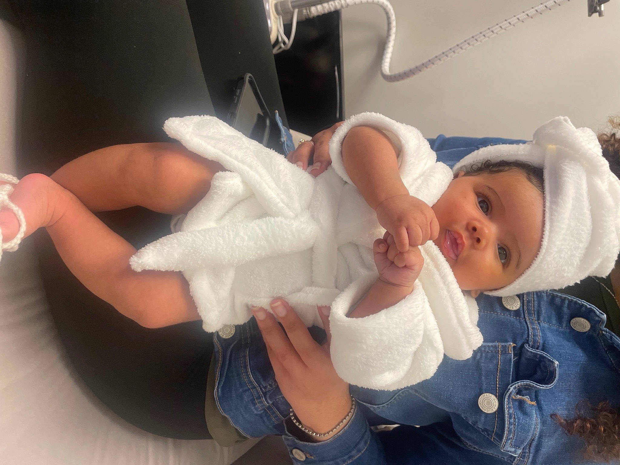 Santana joined the competition — help win amazing prizes! baby, baby_toddler_clothing, child, comfort, denim, dress, family_car, finger, gesture, glasses, hand, happy, head_restraint, jeans, joint, nail, person, skin, thumb, toddler