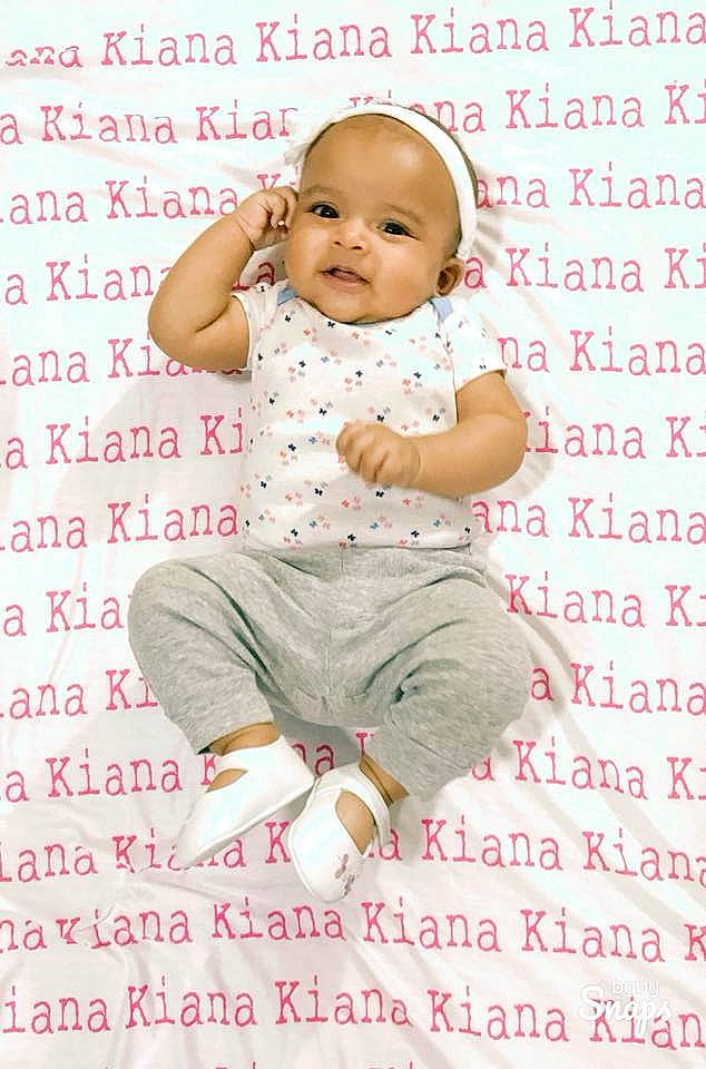 Kiana is registered to the contest to win money with this photo: child, font, friendship, happiness, infant, love, person, photo_caption, pink, product, sitting, smile, text, toddler