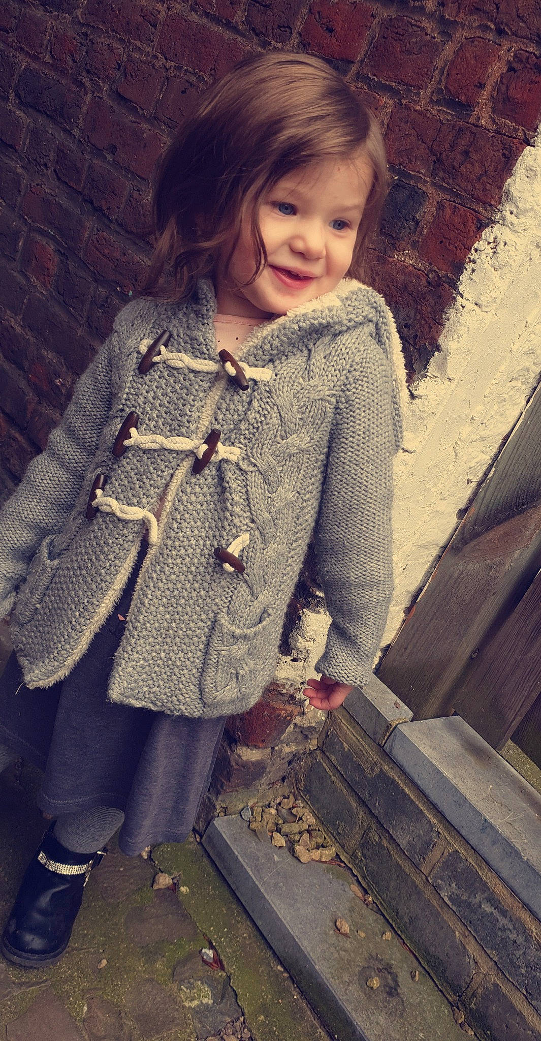 Shayna participe au concours pour gagner de l'argent avec cette photo : art, cardigan, child, child_model, clothing, design, fashion, jacket, joy, knitting, outerwear, pattern, person, sleeve, smile, sweater, textile, toddler, top, woolen