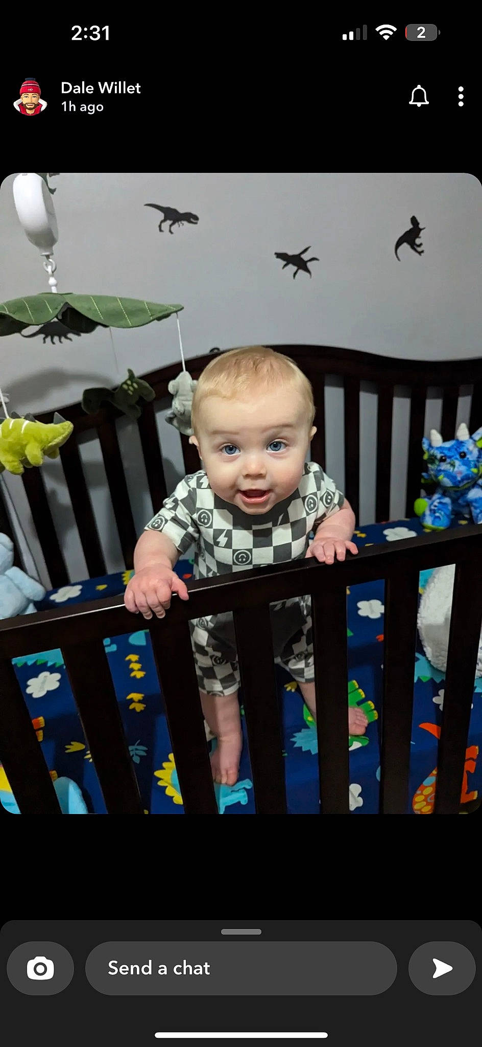Chase is registered to the contest to win money with this photo: baby, baby_products, baby_safety, baby_toddler_clothing, black, cheek, child, cradle, electric_blue, eye, happy, infant_bed, iris, nursery, person, room, sitting, standing, toddler, white