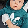 baby, infant, child, hoodie, teal_hoodie, adidas_logo, logo, cute, big_eyes, wide_eyes, portrait, closeup, indoor, hand, adult_hand, holding, sweatshirt, casual_wear, expression, looking_at_camera