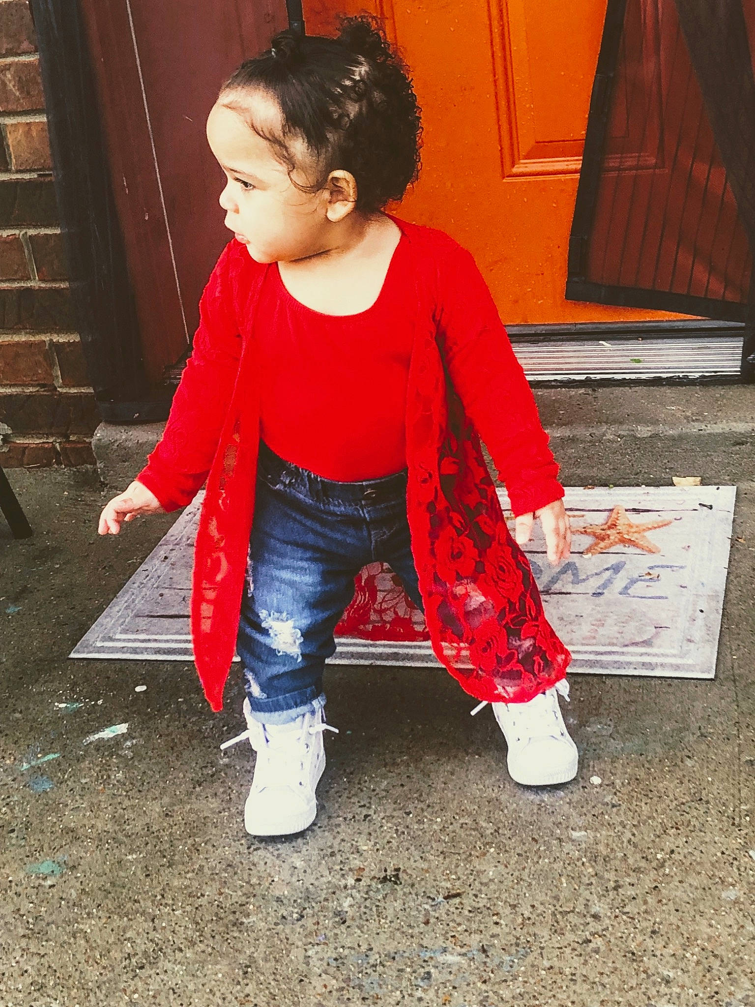 Alora is registered to the contest to win money with this photo: baby_toddler_clothing, carmine, child, floor, flooring, fun, hair, happy, human_leg, leg, pattern, person, sitting, sleeve, standing, street_fashion, textile, thigh, toddler, waist