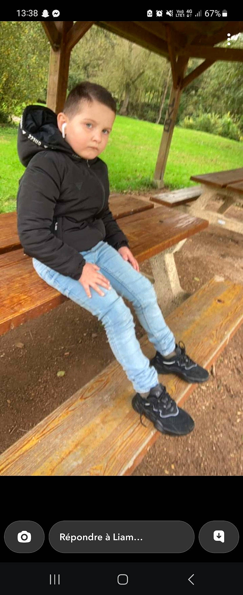 Leo participe au concours pour gagner de l'argent avec cette photo : child, denim, eye, flooring, grass, happy, hardwood, human_leg, jeans, leisure, outdoor_shoe, person, plant, recreation, shoe, sitting, sneakers, soil, toddler, wood