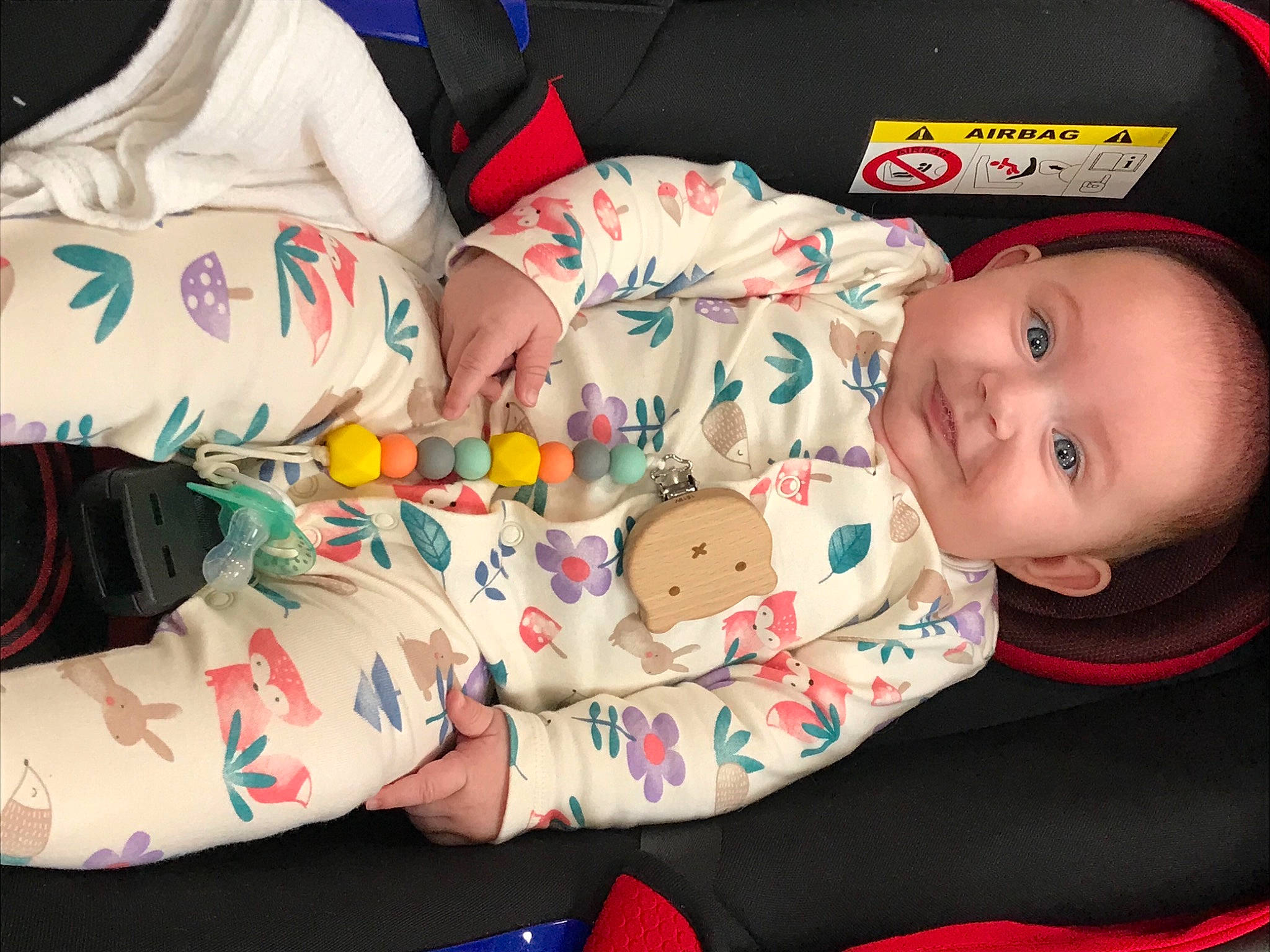 Octavia is registered to the contest to win money with this photo: baby, baby_toddler_clothing, cheek, comfort, face, finger, hand, head, human_body, joy, leg, mammal, mouth, organ, person, product, skin, sleeve, smile, textile