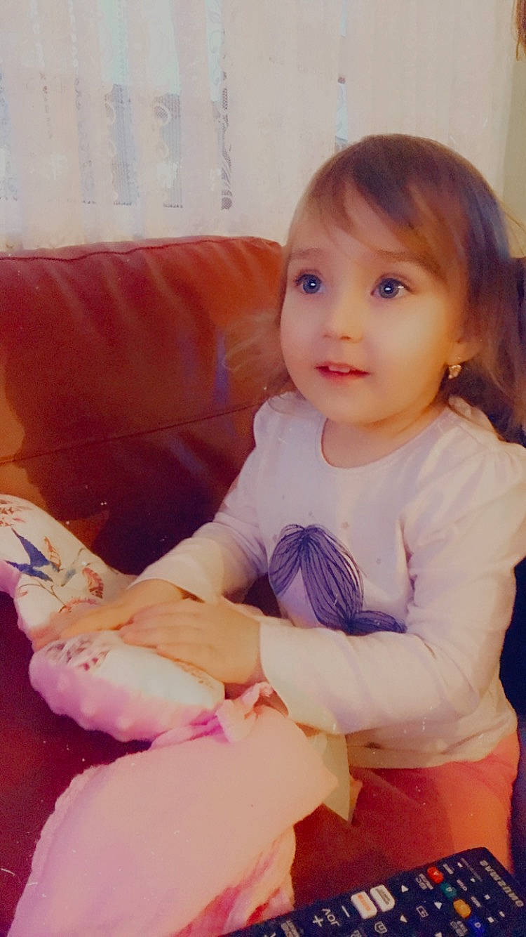 Jessica joined the competition — help win amazing prizes! baby_toddler_clothing, cheek, comfort, facial_expression, finger, fun, hairstyle, hand, happy, human_leg, lap, lip, person, pink, product, skin, sleeve, sock, thigh, thumb