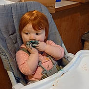 Rory joined the competition — help win amazing prizes! toddler, high_chair, red_hair, messy, food, blue_food, kitchen, snacks, boxes, pepsi, wafers, child, curious, pink_clothing, indoor, face, hands, seat, table, eating