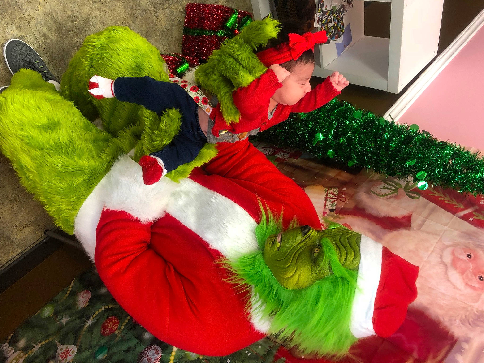 Alexia is registered to the contest to win money with this photo: christmas, christmas_decoration, event, fictional_character, fur, holiday, interior_design, person, plant, santa_claus, tree