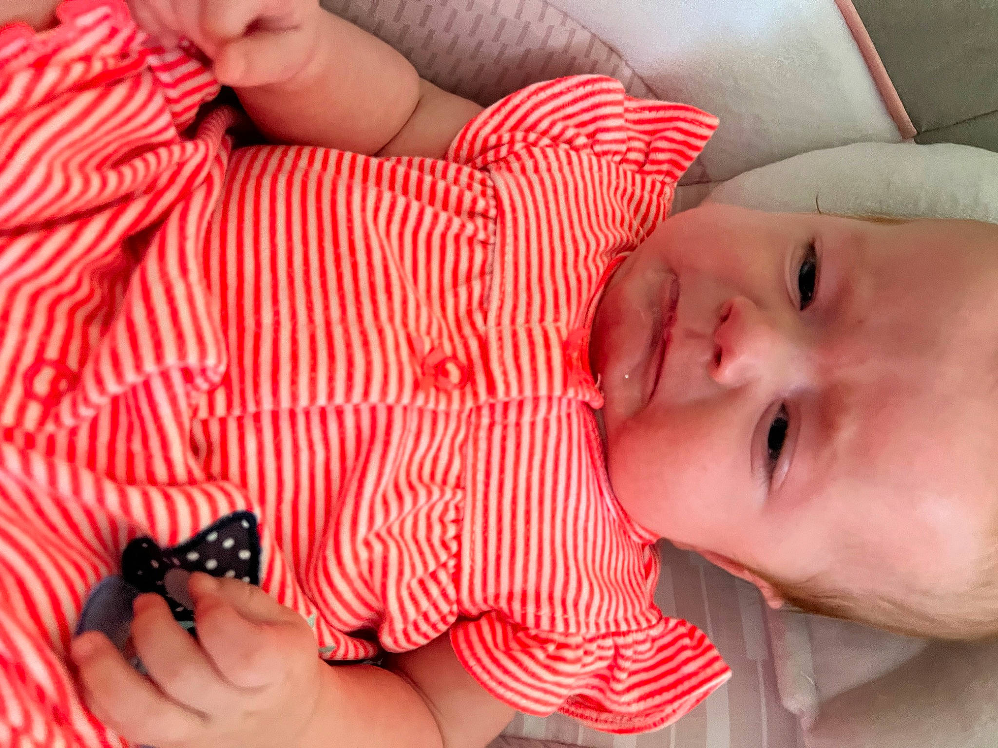 Mackenzie joined the competition — help win amazing prizes! arm, baby, baby_toddler_clothing, cheek, eye, finger, hand, head, human_body, lip, mammal, mouth, muscle, nose, orange, organ, person, skin, smile, textile