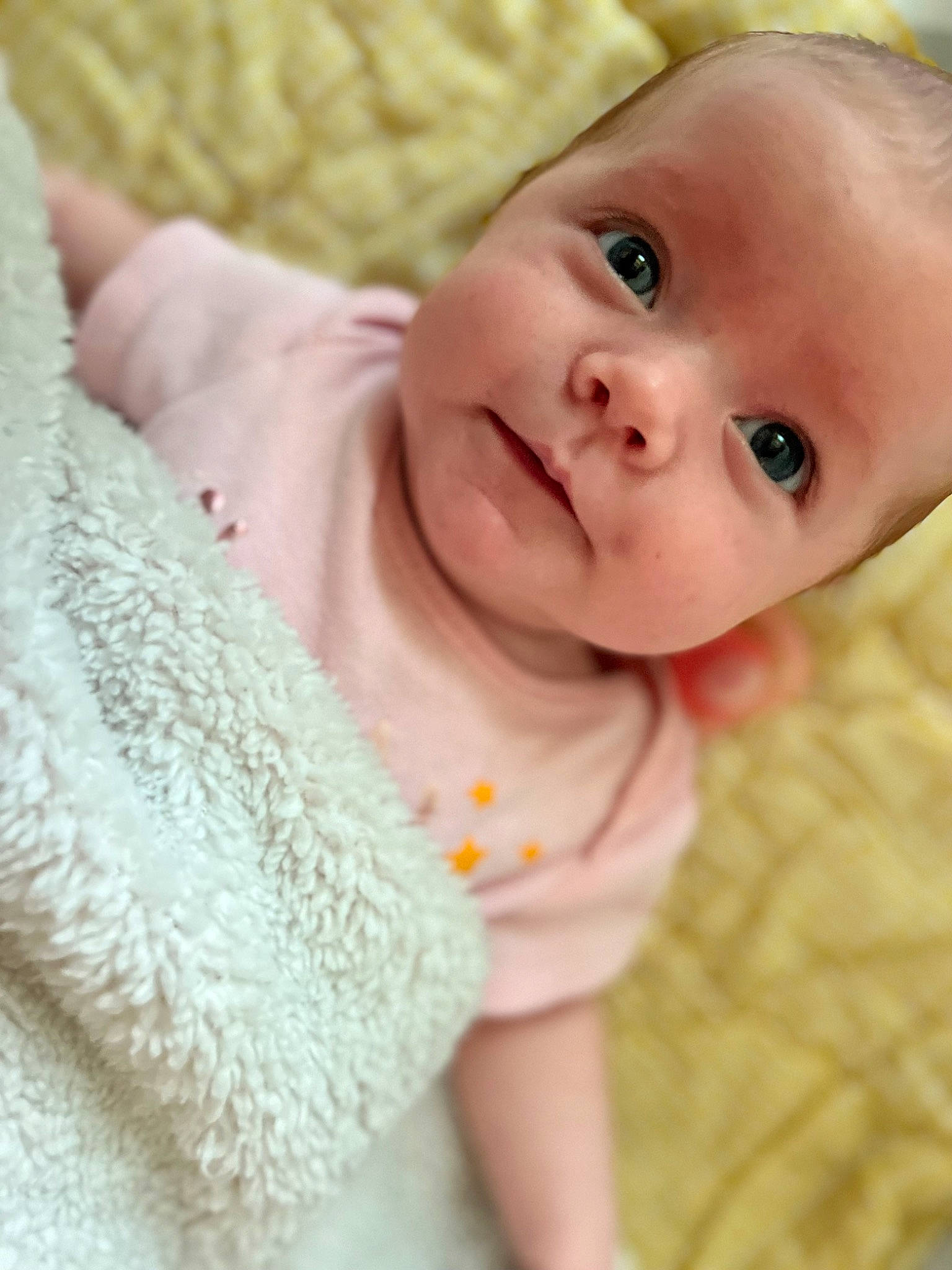 Mackenzie is registered to the contest to win money with this photo: baby, baby_products, baby_toddler_clothing, cheek, child, comfort, eye, face, happy, head, iris, linens, lip, nose, pattern, person, pink, skin, sleeve, smile