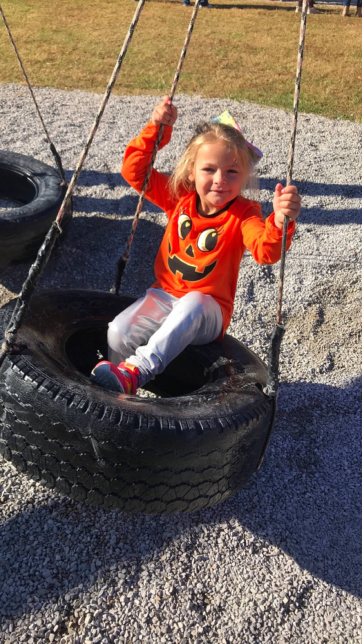 Gabriella Hays is registered to the contest to win money with this photo: auto_part, automotive_tire, automotive_wheel_system, joy, outdoor_play_equipment, person, play, swing, tire, wheel
