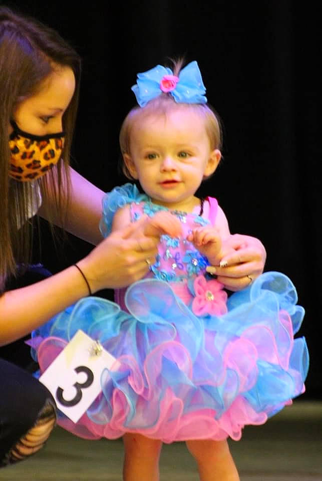 Akira joined the competition — help win amazing prizes! baby, baby_toddler_clothing, child, costume, entertainment, event, fashion_accessory, finger, fun, gesture, happy, head, headpiece, jewellery, magenta, performing_arts, person, pink, purple, thumb