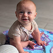 Cole joined the competition — help win amazing prizes! baby, child, infant, crawling, smiling, face, eyes, skin, clothing, blanket, pattern, colorful, floor, indoors, cute, happy, hands, feet, portrait, natural_light