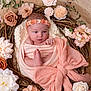 newborn, baby, infant, wrapped, blanket, headband, flower, wreath, pastel, soft, sleepy, cute, portrait, studio, decor, pink, peach, resting, peaceful, toddler