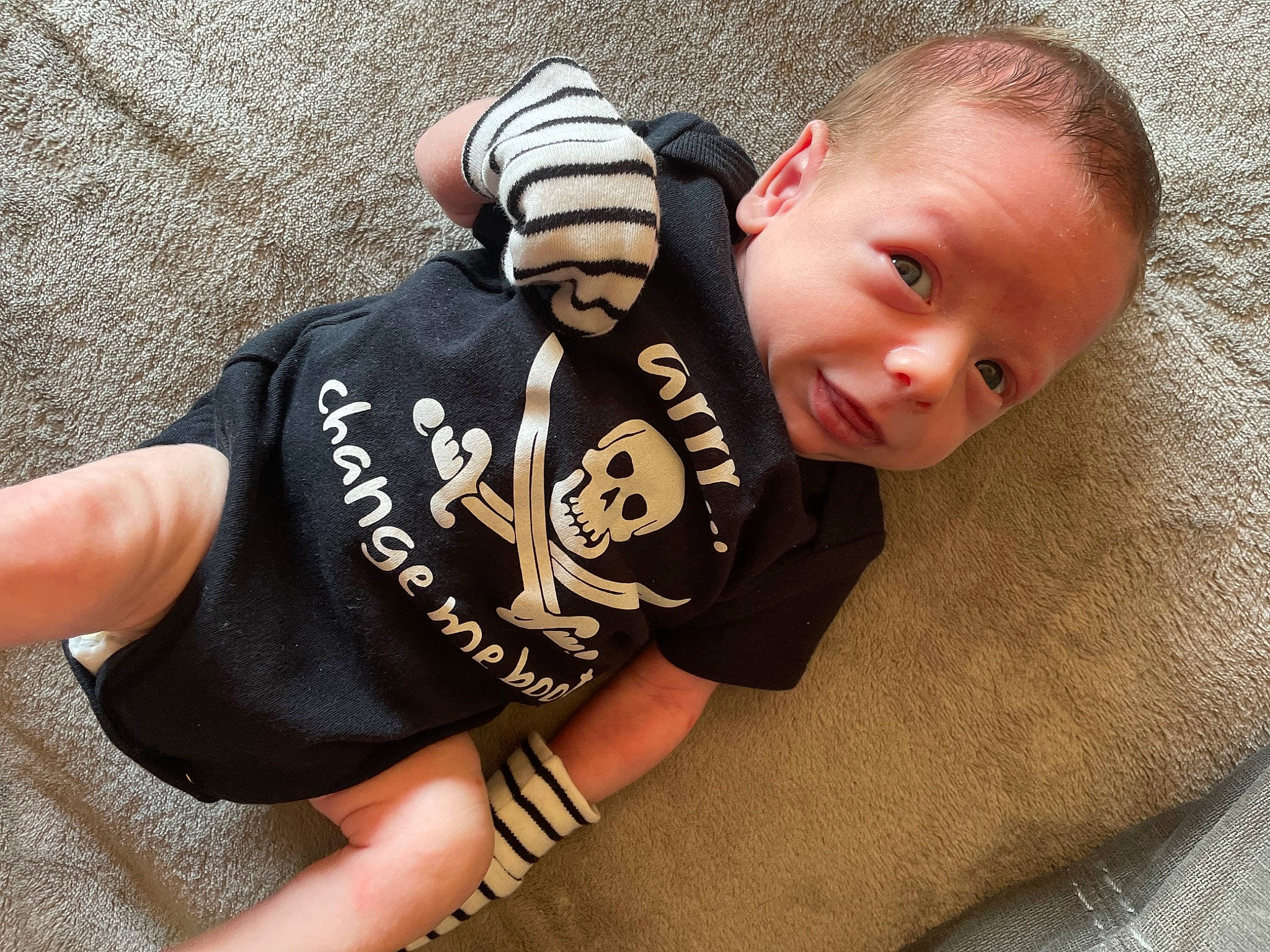 Jaxxon is registered to the contest to win money with this photo: baby, baby_toddler_clothing, child, comfort, elbow, flooring, grass, happy, head, human_body, pattern, person, sitting, sleeve, smile, sportswear, t_shirt, thigh, thumb, toddler