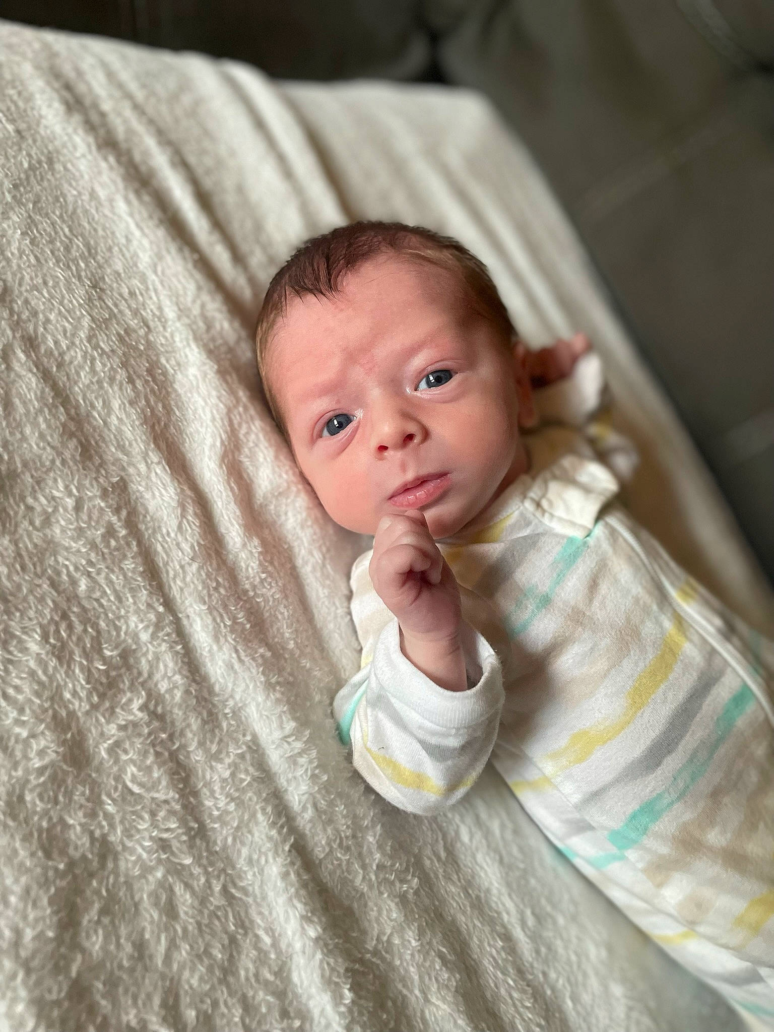 Jaxxon is registered to the contest to win money with this photo: baby, baby_toddler_clothing, cheek, child, chin, comfort, eye, face, flash_photography, flooring, hairstyle, head, iris, linens, nose, person, sitting, skin, sleeve, toddler