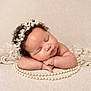 Milana joined the competition — help win amazing prizes! baby, sleeping, curly_hair, headband, pearls, lace, arms, peaceful, soft_texture, infant, portrait, closeup, resting, cute, adorable, newborn, skin, face, hands, studio