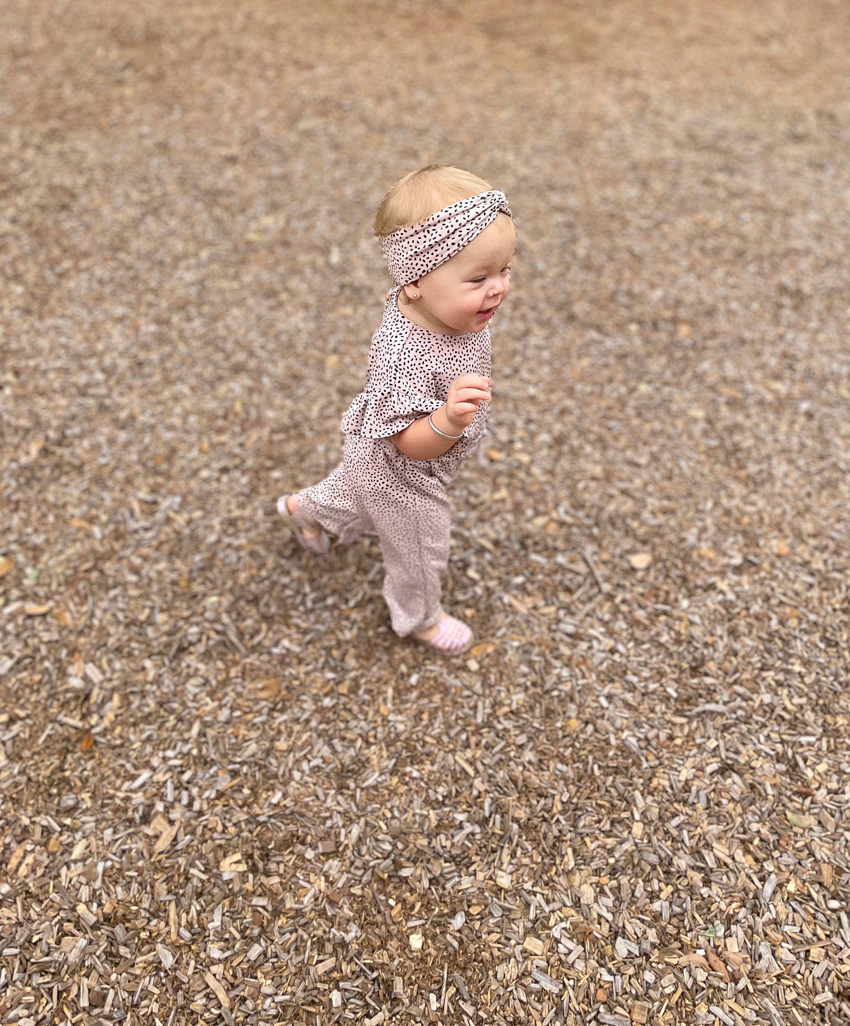 Berklee is registered to the contest to win money with this photo: asphalt, autumn, baby, baby_toddler_clothing, child, field, flooring, fun, grass, grass_family, headwear, landscape, people_in_nature, person, road_surface, sand, shadow, sitting, soil, toddler