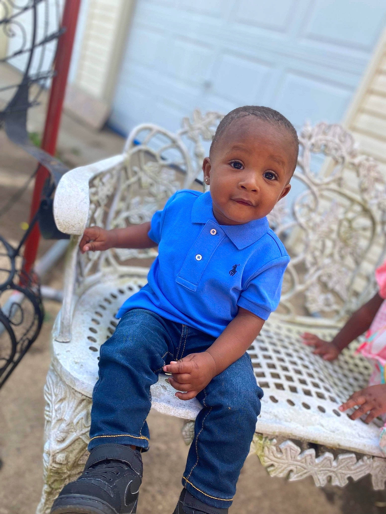 Kingston is registered to the contest to win money with this photo: baby, baby_toddler_clothing, child, city, denim, electric_blue, fun, happy, leisure, person, play, recreation, rope, sandal, sitting, soil, textile, toddler, tradition, tree