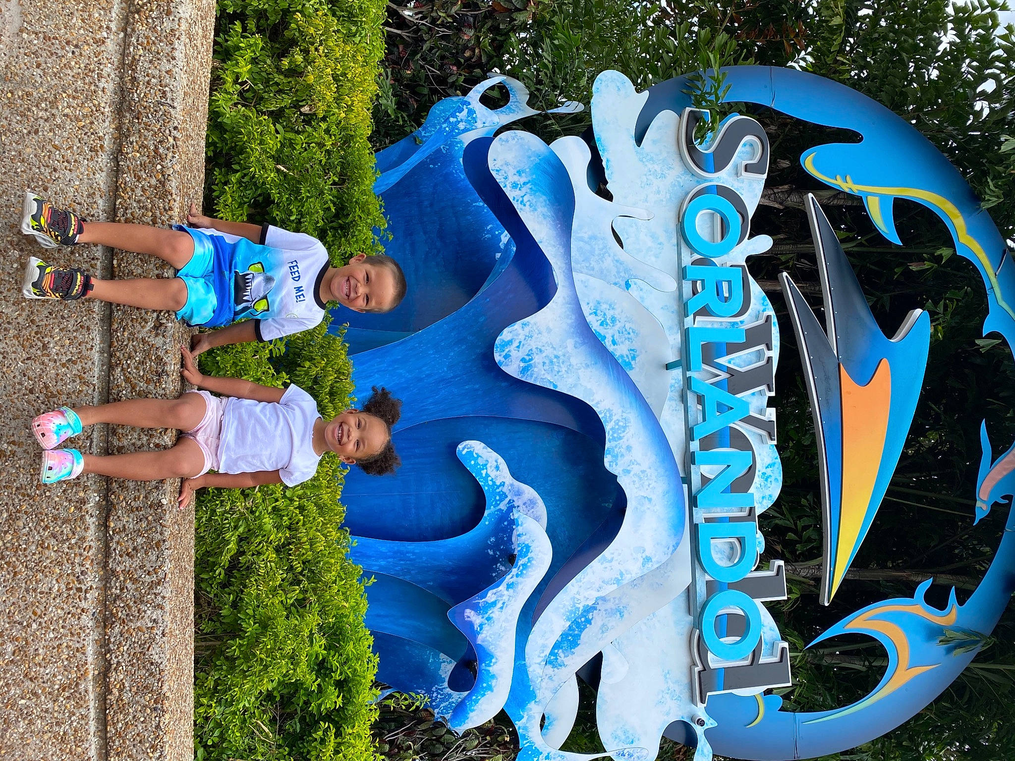 Jazelle is registered to the contest to win money with this photo: art, azure, blue, cool, electric_blue, font, fun, graffiti, grass, happy, joy, leisure, person, plant, recreation, shoe, smile, toddler, tree, visual_arts