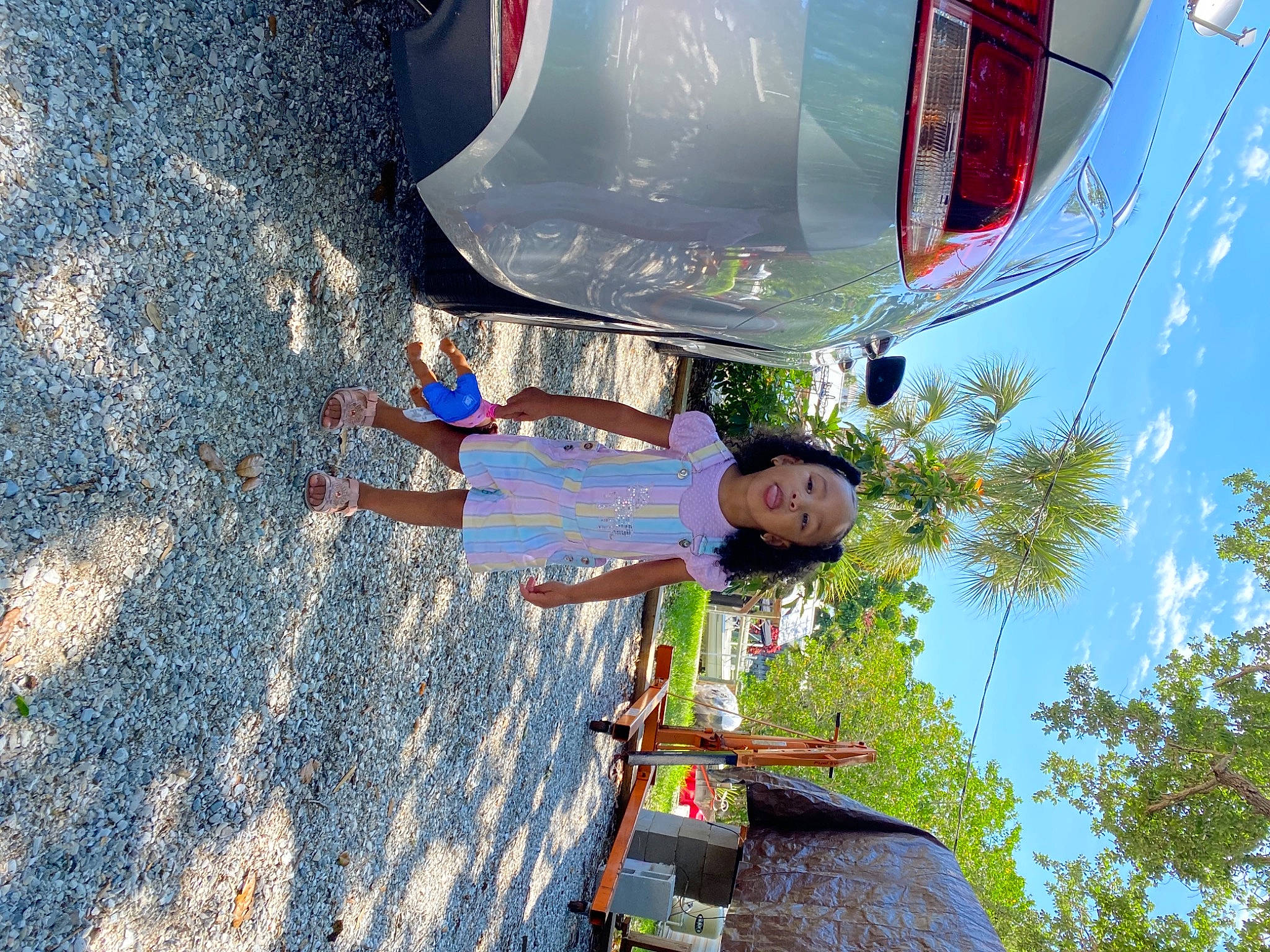Jazelle joined the competition — help win amazing prizes! adventure, asphalt, automotive_exterior, automotive_lighting, bumper, child, city, electric_blue, fun, landscape, leisure, outdoor_recreation, person, recreation, sky, smile, toddler, travel, tree, vehicle_door