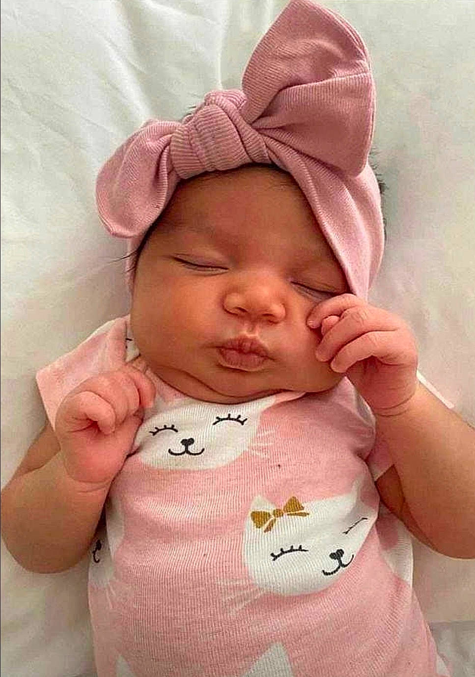Lyanna is registered to the contest to win money with this photo: baby, baby_sleeping, bonnet, cheek, child, head, headgear, headwear, person, pink, toddler