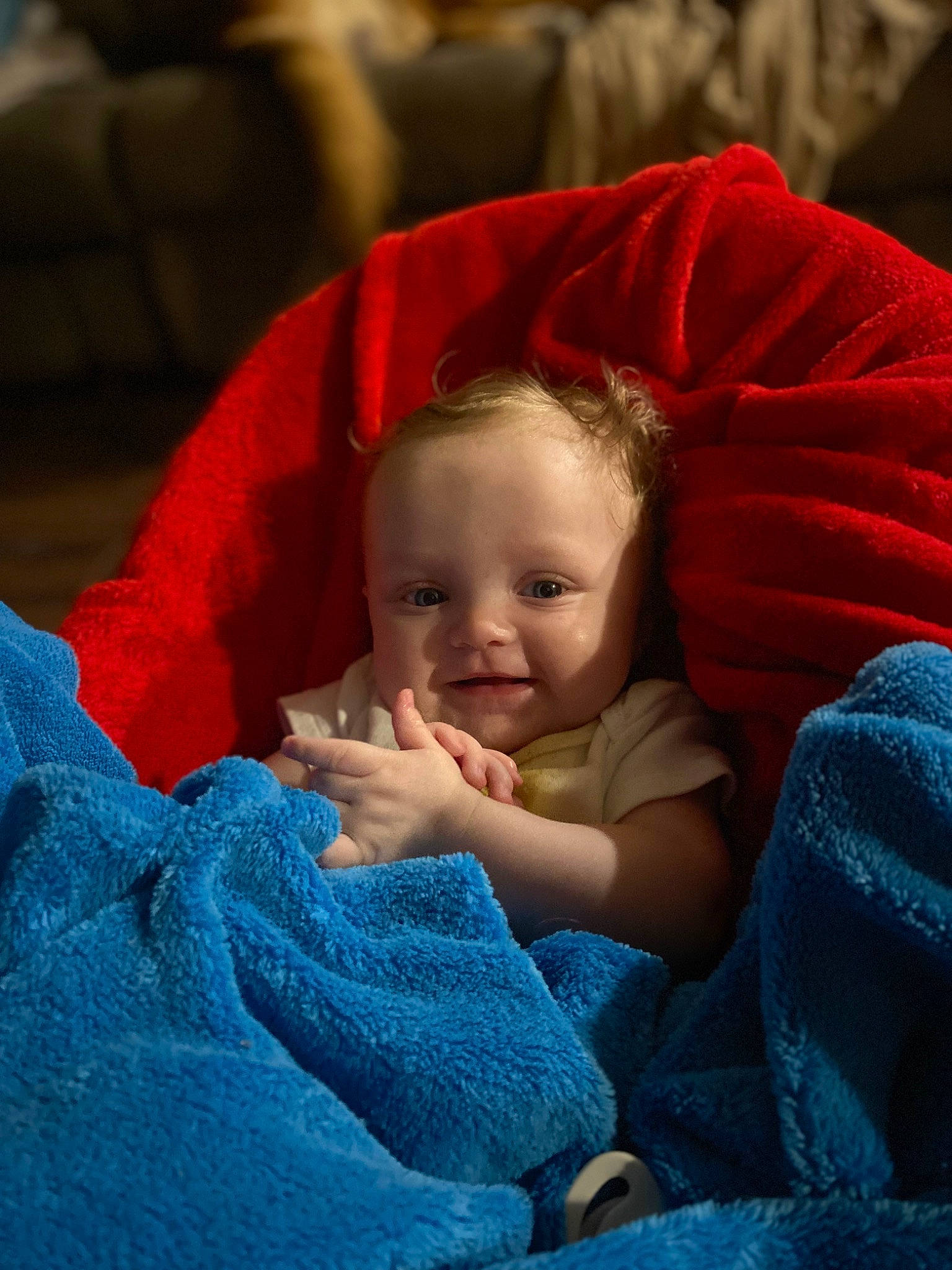 Amara is registered to the contest to win money with this photo: baby, baby_toddler_clothing, carmine, cheek, child, comfort, electric_blue, event, eye, fun, fur, happy, head, iris, lap, linens, person, sitting, sleeve, smile