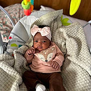 Reumani joined the competition — help win amazing prizes! baby, baby_seat, blanket, brown_pants, child, colorful, cozy, cute, dangle, fox_design, headband, indoor, infant, portrait, relaxed, soft_texture, sweater, toy, white_socks, wooden_background