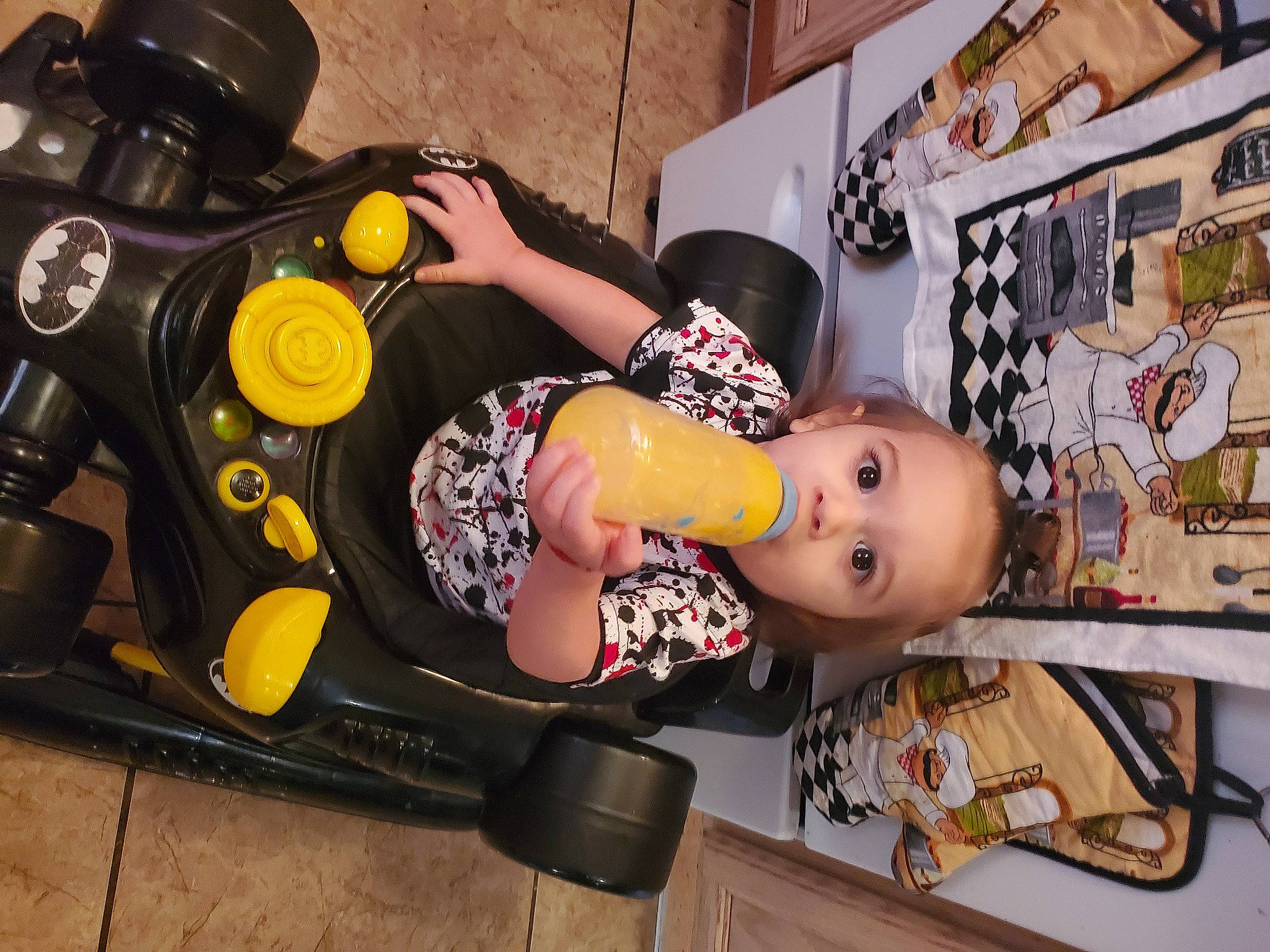 Jose is registered to the contest to win money with this photo: auto_part, automotive_design, automotive_exterior, automotive_tire, automotive_wheel_system, baby, baby_products, child, doll, fun, headgear, motor_vehicle, person, personal_protective_equipment, rim, room, sandal, tire, toddler, toy