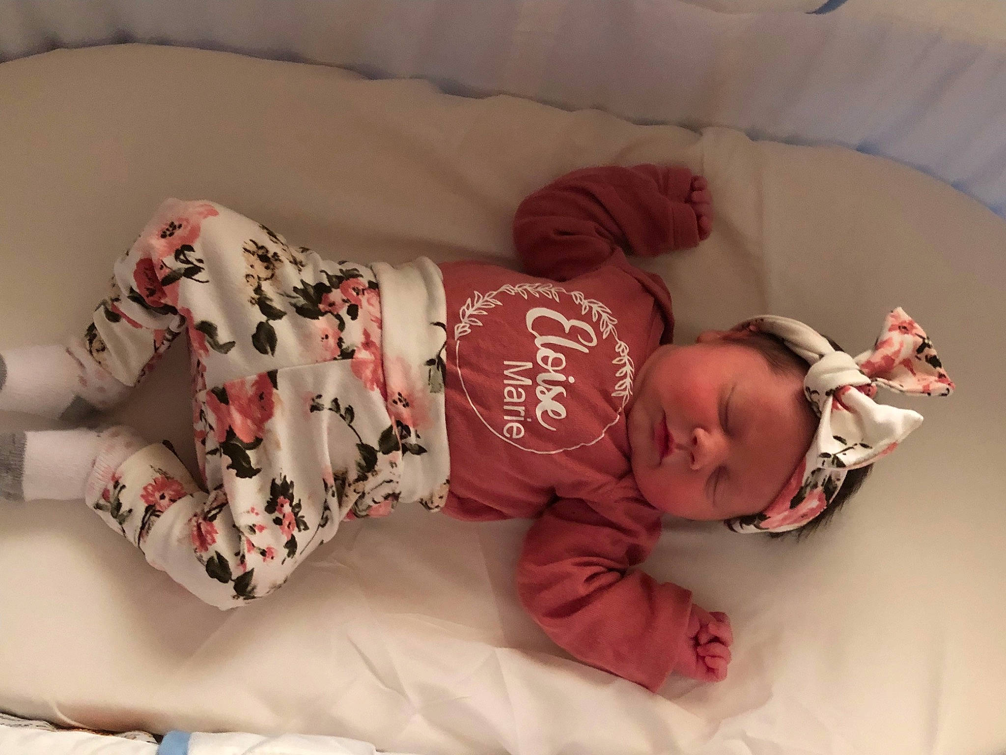 Eloise joined the competition — help win amazing prizes! baby, baby_products, baby_sleeping, baby_toddler_clothing, bedding, child, comfort, couch, headwear, human_body, linens, mammal, pattern, person, pink, room, sitting, skin, sleeve, sock
