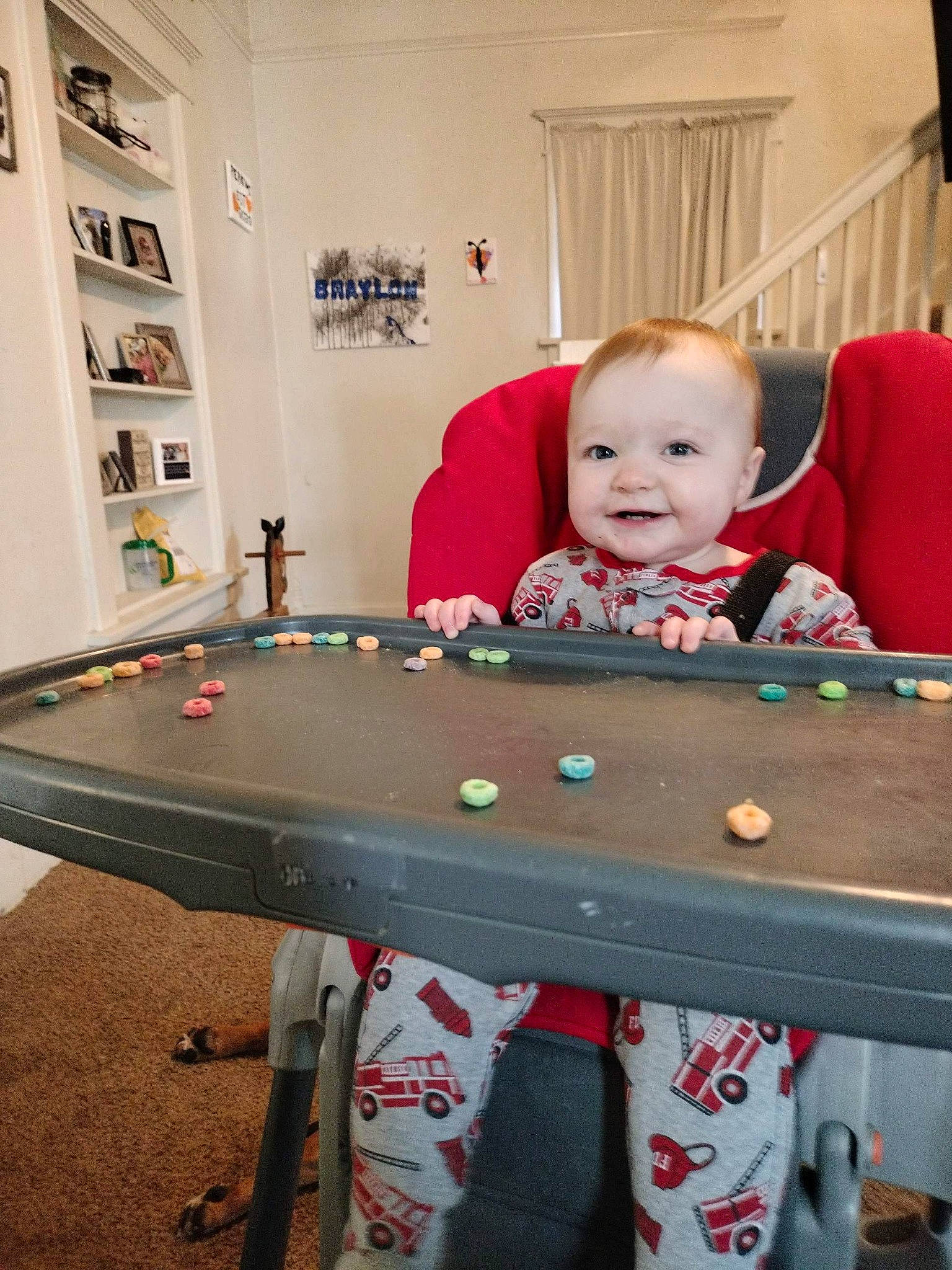 Luella is registered to the contest to win money with this photo: baby, baby_toddler_clothing, chair, child, fun, happy, indoor_games_and_sports, joy, person, picture_frame, play, recreation, recreation_room, room, sitting, sleeve, smile, sports_equipment, t_shirt, table
