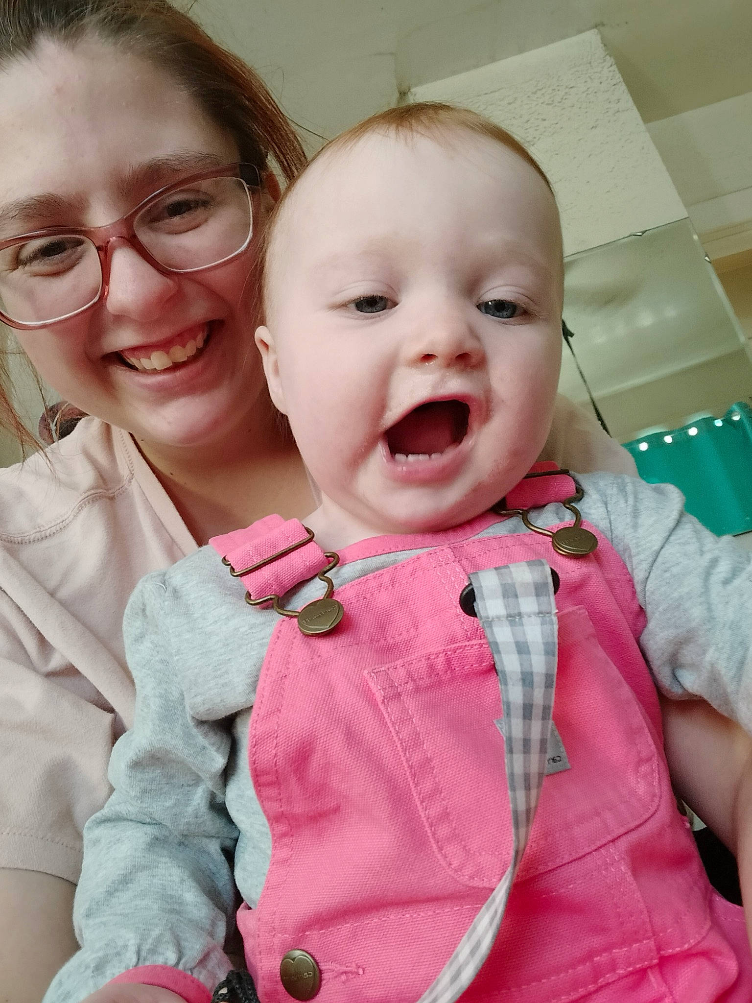 Luella is registered to the contest to win money with this photo: baby_toddler_clothing, cheek, chin, ear, eye, eyebrow, facial_expression, gesture, happy, head, iris, joy, lip, mouth, nose, person, pink, product, skin, sleeve