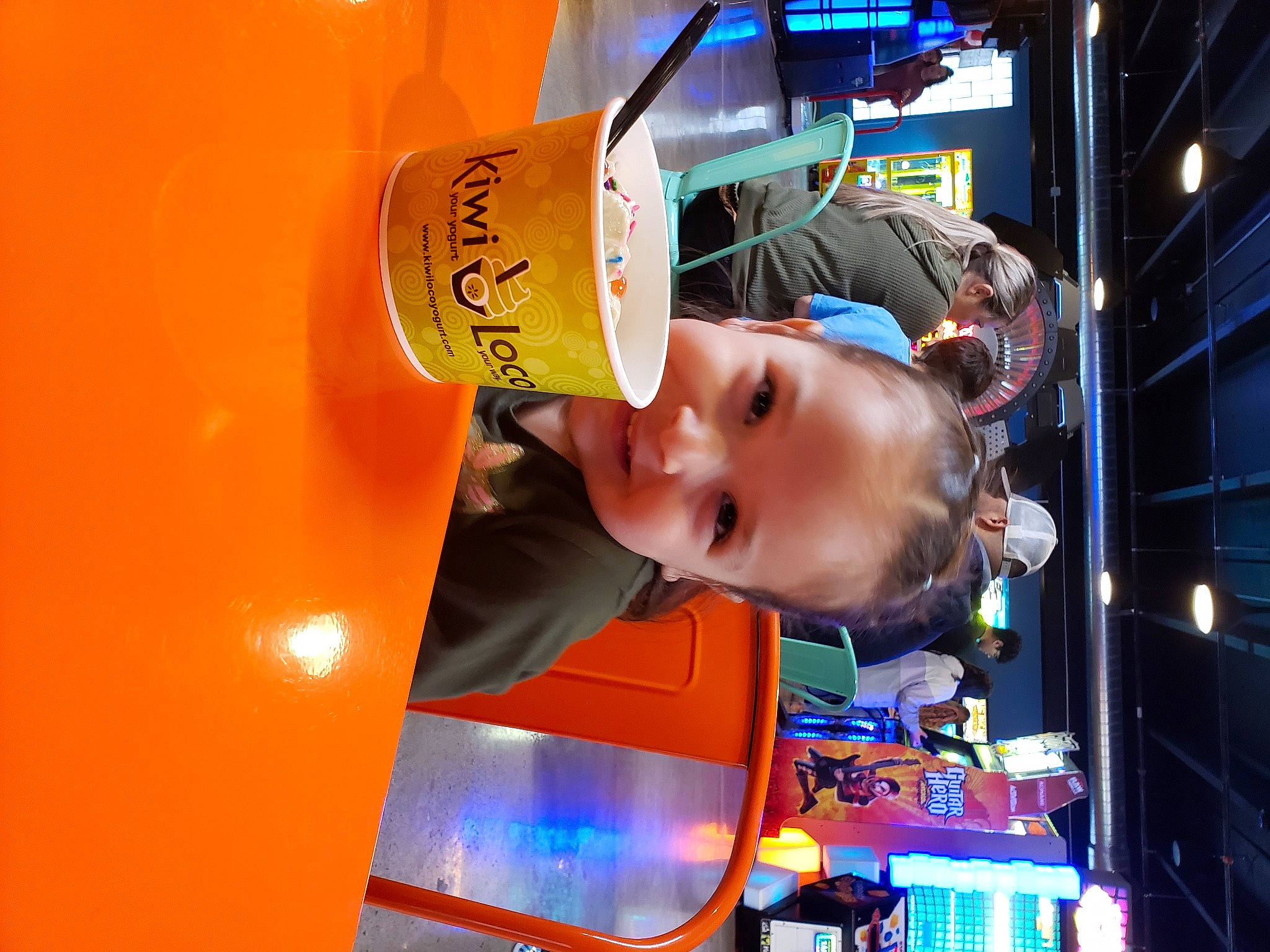 Harper is registered to the contest to win money with this photo: automotive_lighting, baby, child, city, drink, electric_blue, fun, joy, leisure, light, machine, orange, person, recreation, smile, t_shirt, toddler