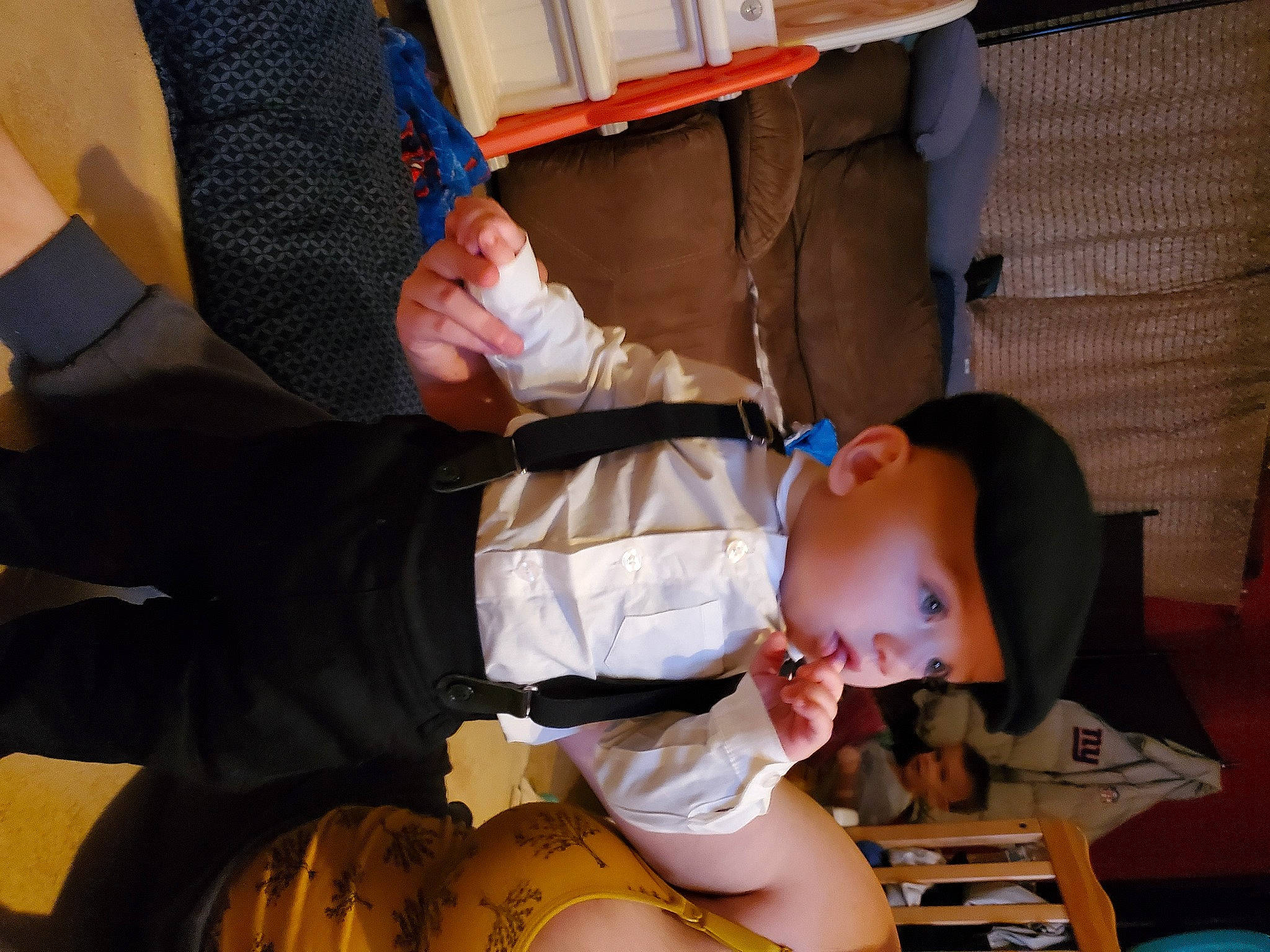 Matteo is registered to the contest to win money with this photo: baby, baby_products, chair, child, comfort, foot, fun, gesture, headwear, human_leg, knee, lap, leg, leisure, person, room, shorts, sitting, sock, thigh