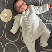 Sharvik joined the competition — help win amazing prizes! 3_months, baby, celebration, child, cute, face, feet, gray_blanket, hands, indoor, infant, lying_down, milestone, newborn, patterned_blanket, portrait, soft_fabric, white_onesie, wooden_plaque, zipped_clothing