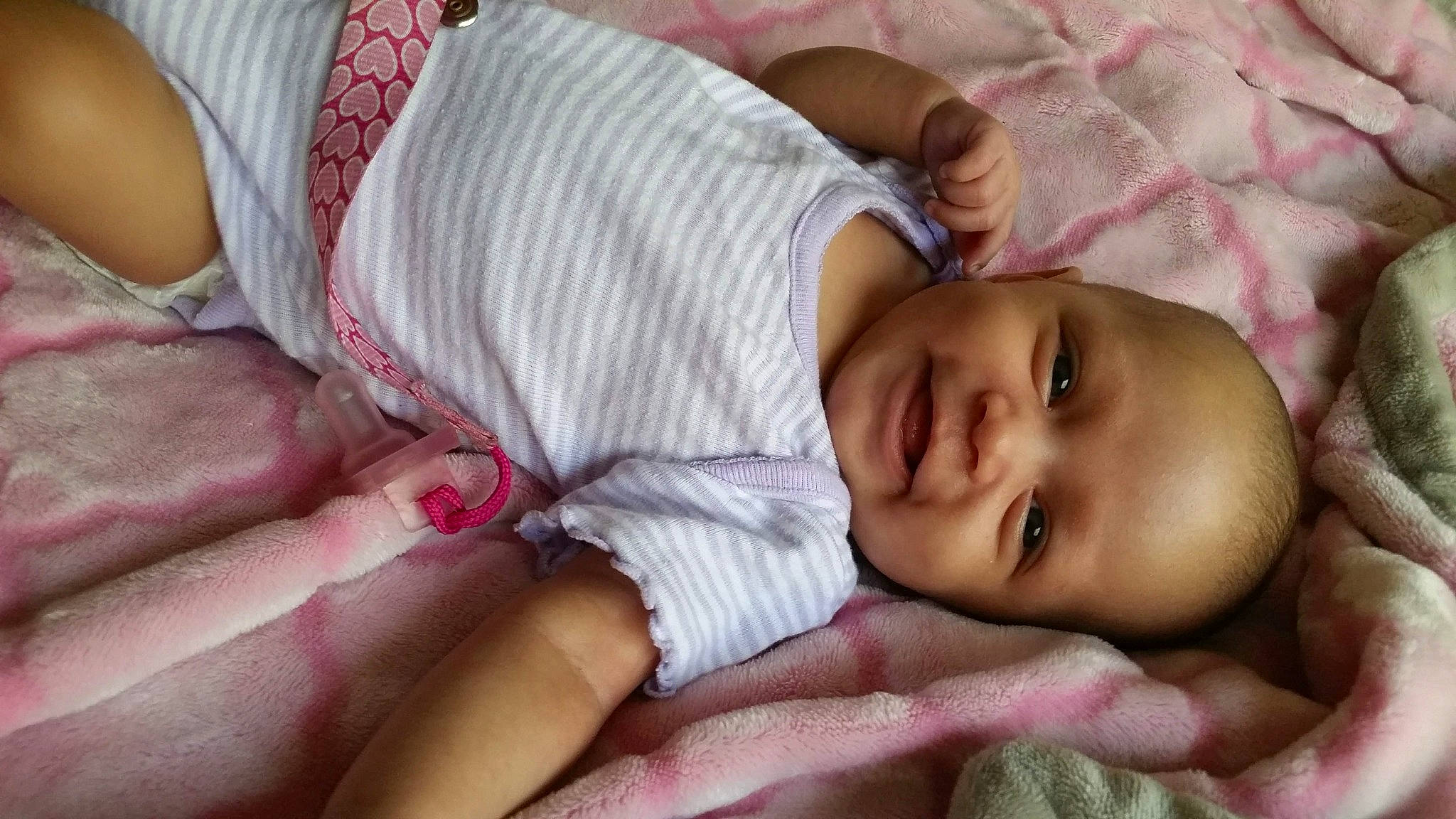 Kiera is registered to the contest to win money with this photo: baby, bedtime, cheek, child, eye, mouth, nose, person, pink, skin, toddler