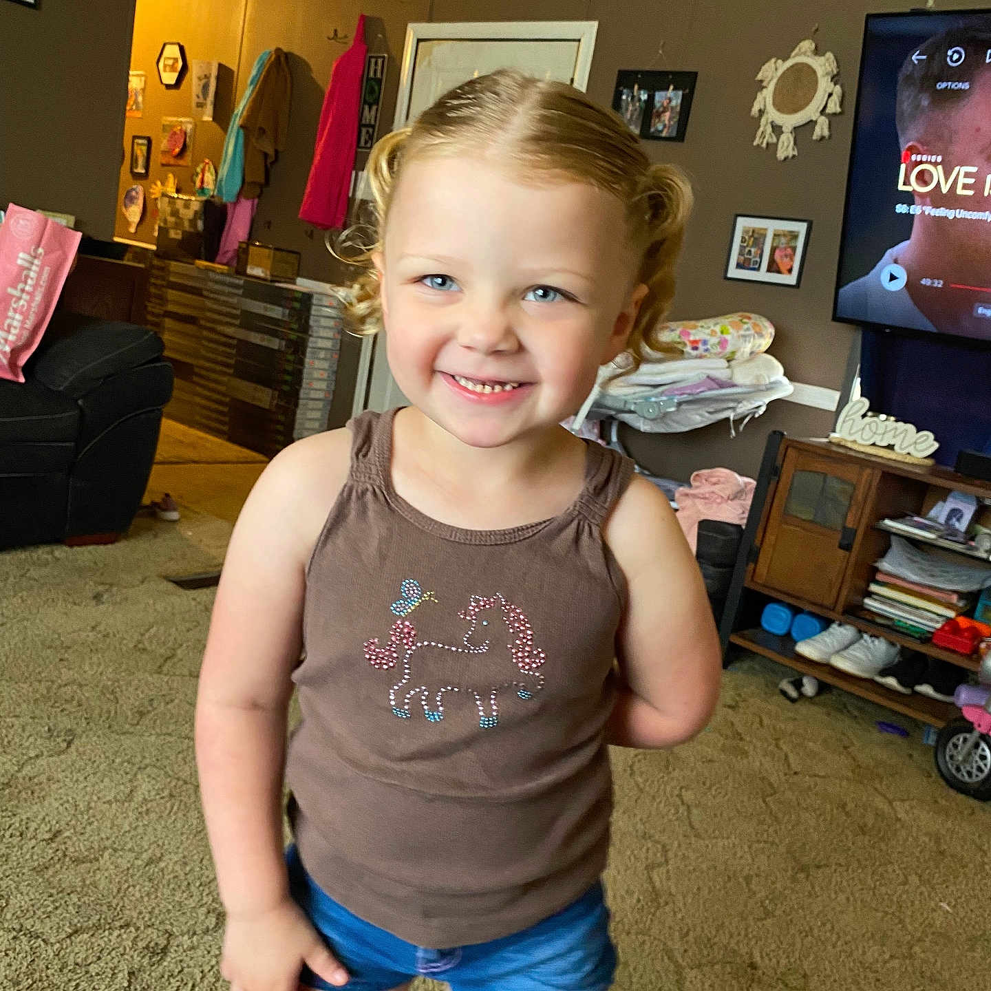 Clara Mae is registered to the contest to win money with this photo: architecture, building, child, clothing, computerhardware, electronics, face, female, furniture, girl, head, indoors, livingroom, person, photography, portrait, room, screen, shorts, t_shirt