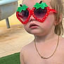 Maëna participe au concours pour gagner de l'argent avec cette photo : child, sunglasses, strawberry, outdoor, necklace, shirtless, blond_hair, curious, expression, summer, greenery, grass, playground, casual, cute, portrait, fashion, accessory, sunny, daytime