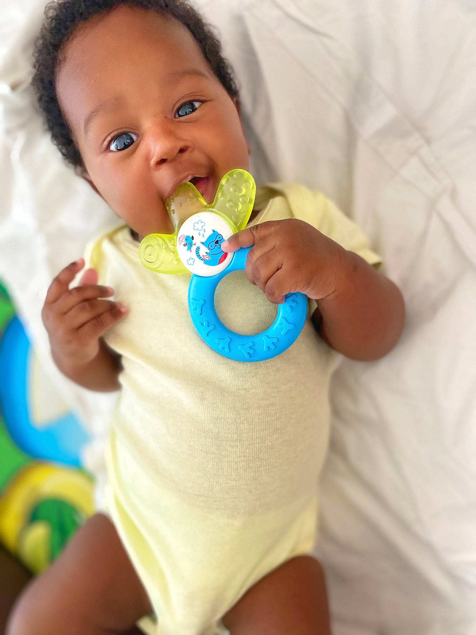 Lynaël a rejoint le concours — aidez-le/la à gagner de superbes lots ! baby, baby_toddler_clothing, cheek, dress, drinkware, eye, face, finger, gesture, hand, happy, head, iris, mouth, nail, neck, nose, person, skin, textile