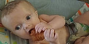 Remington joined the competition — help win amazing prizes! baby, infant, food, croissant, snack, seat, baby_seat, hand, face, eyes, mouth, clothing, pattern, comfort, indoor, cute, child, relaxing, skin, expression